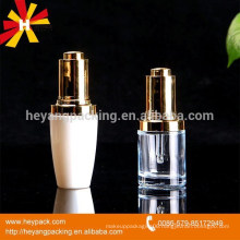 transparent and white glass hand pressure dropper bottle